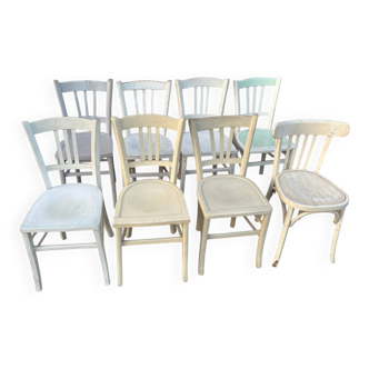 Set of 8 mismatched white bistro chairs