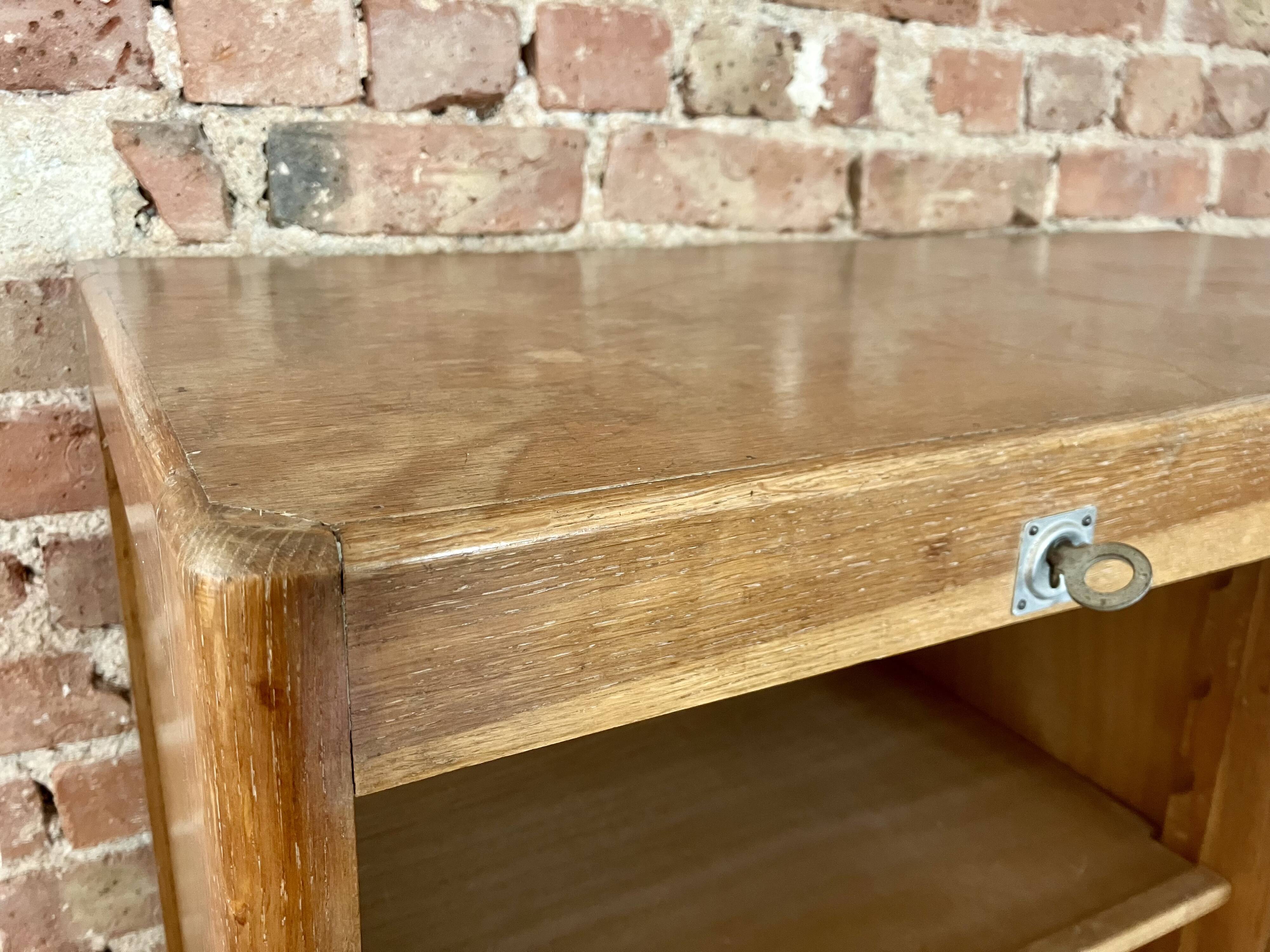 Double curtain filing cabinet in oak — on legs