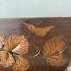 Art Deco jardinière in carved wood, decorated with roses.