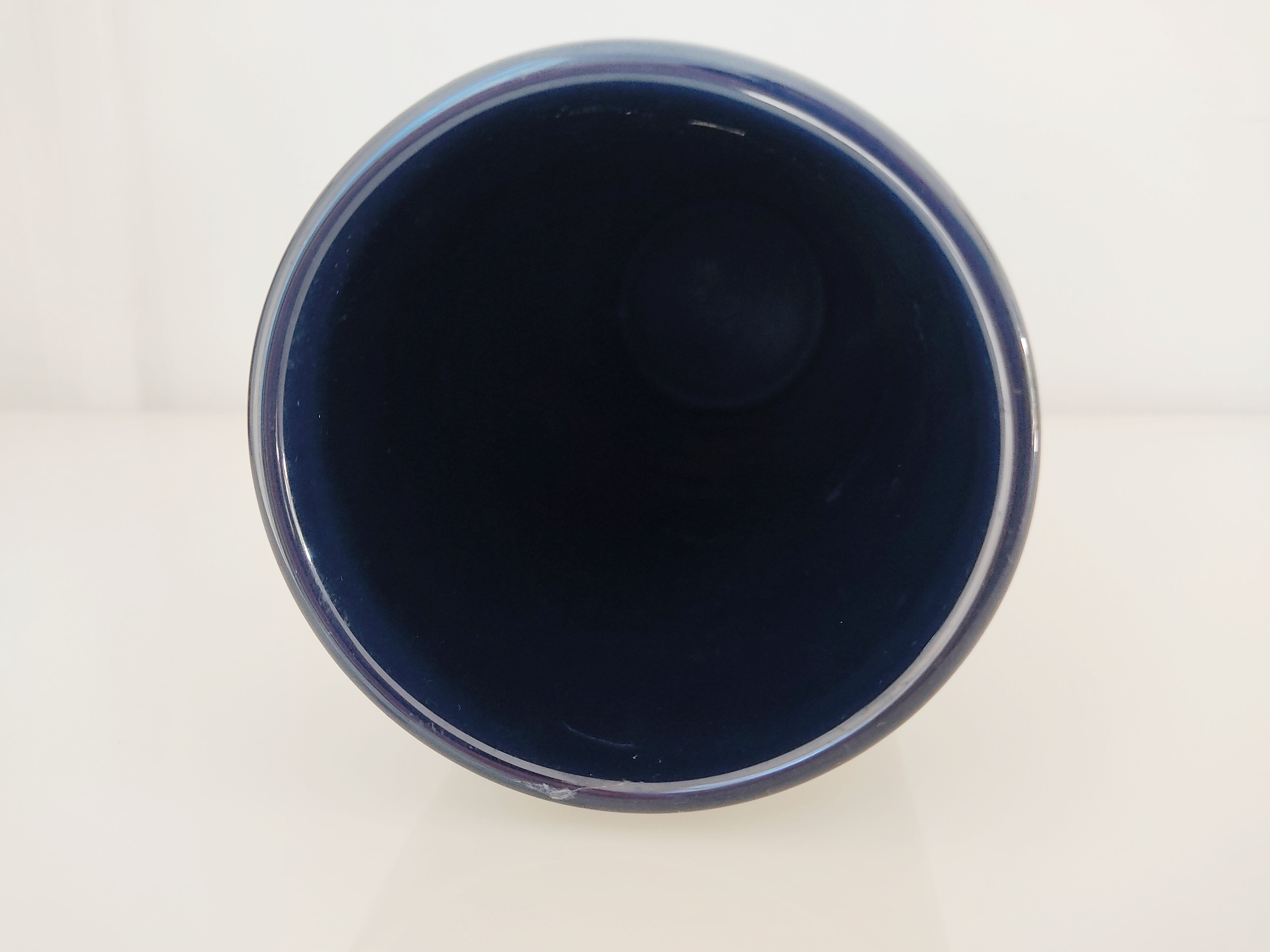 Dark blue ceramic roller vase