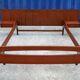 Teak bed with hanging bedside tables from the 60s