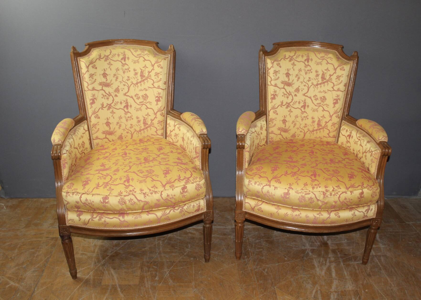 Pair of Louis XVI Bergères in walnut, late 18th century.