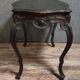 Antique desk in the Louis XV style, resting on four curved legs.
