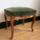 Louis XV footrest in carved wood and green velvet