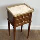 Pair of mahogany and brass side tables or bedside tables with Carrara marble tops.