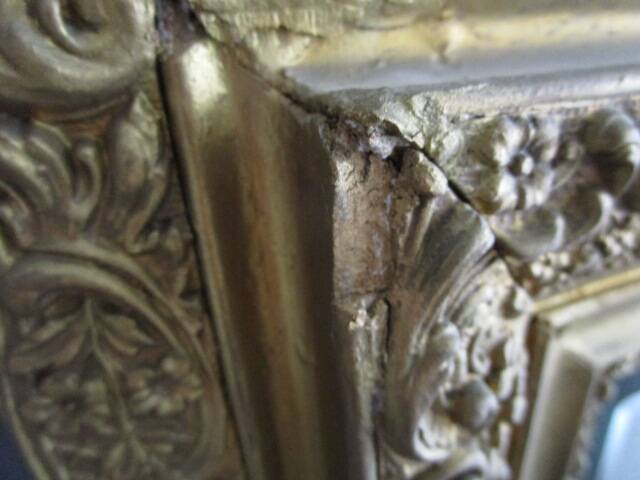 Large antique mirror in wood and gilded stucco.