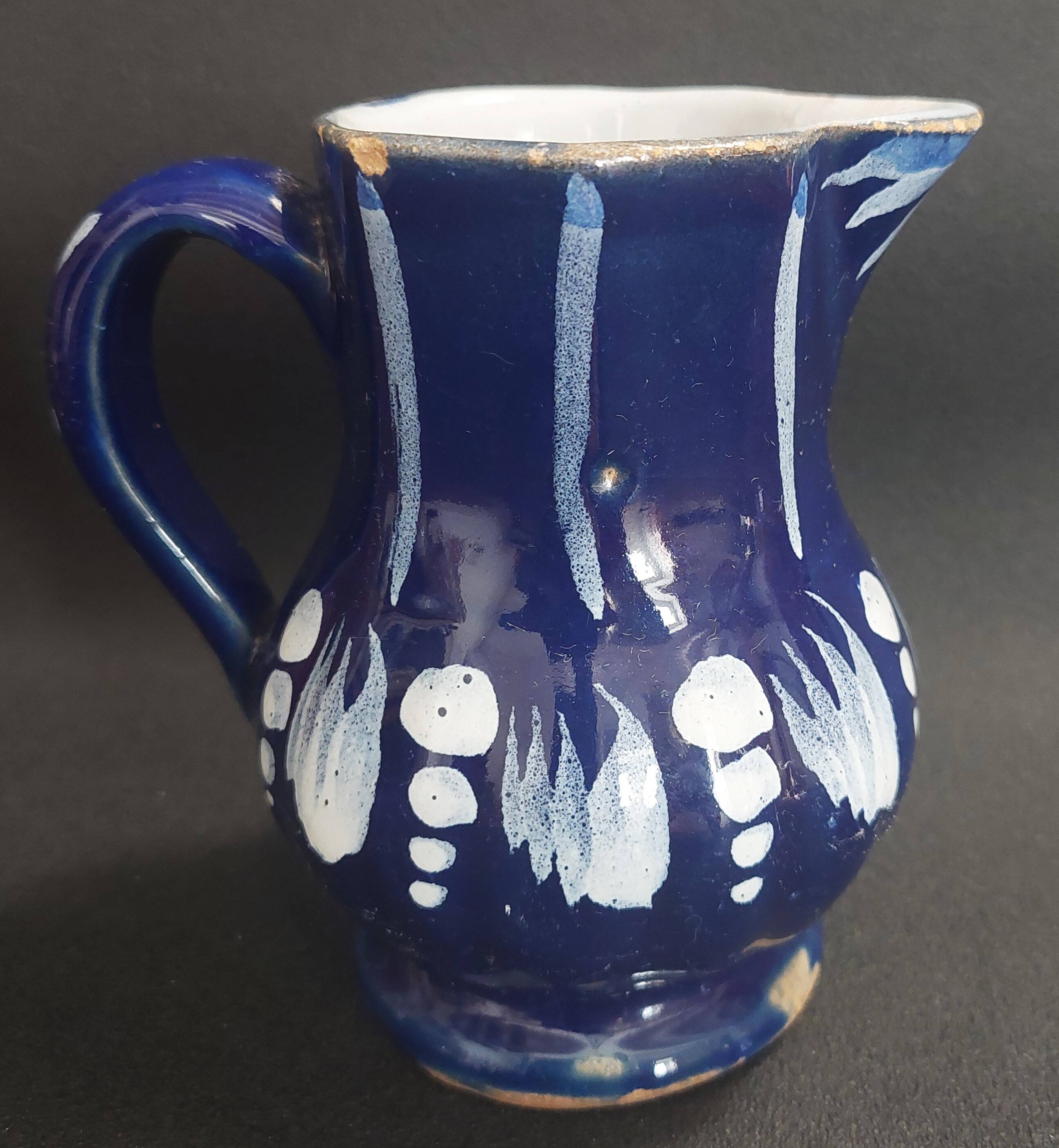 Earthenware pitcher from the North of France with blue covering, 19th century