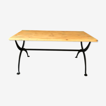 Raw wood table, hammered metal footing