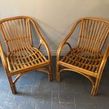 Duo of rattan armchairs with cushions