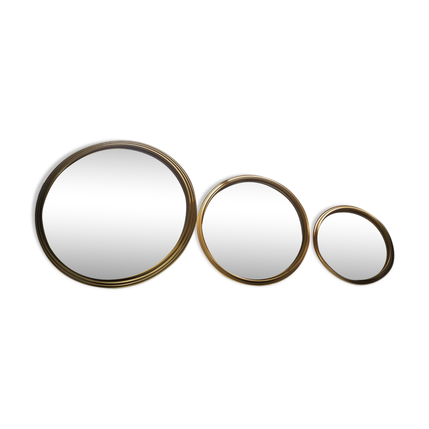 Suite of three brass mirrors