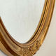 Oval mirror in carved wood