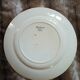 13 mismatched flat plates in ironstone