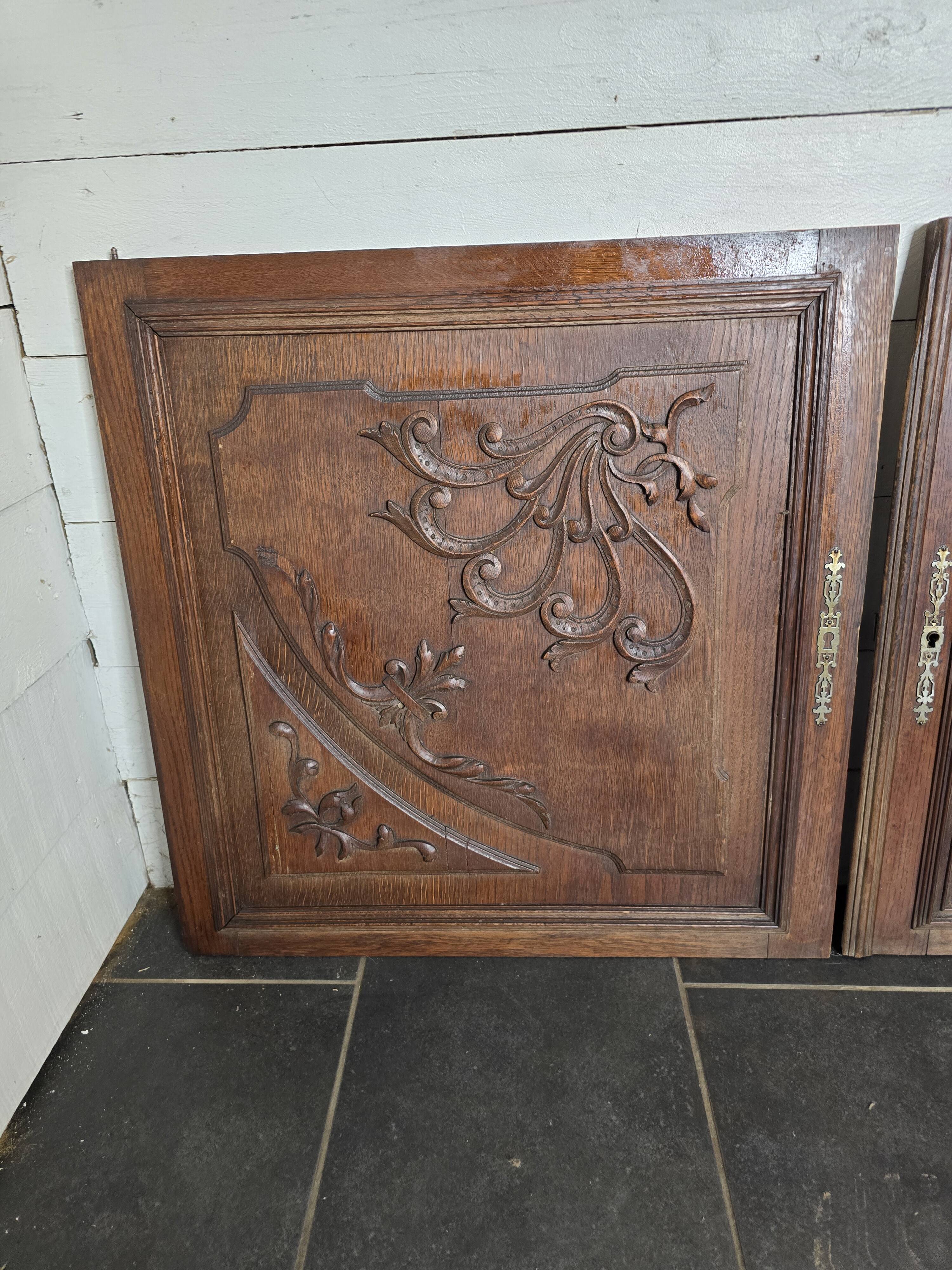 Pair of carved oak wooden doors