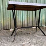Vintage bistro table with an Art Deco style cast iron base and Formica top.