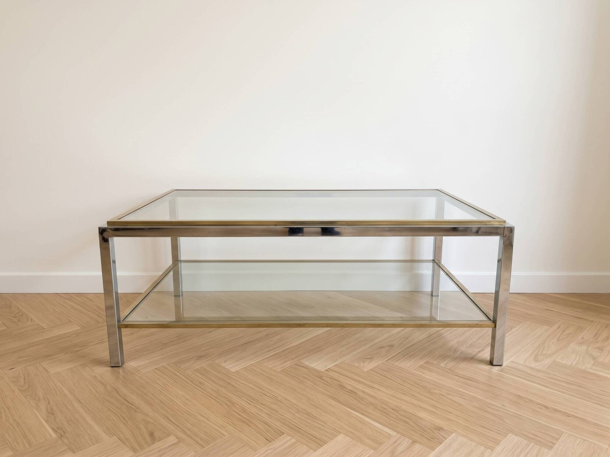 Vintage 1970s coffee table in brass and chrome in the style of Willy Rizzo.