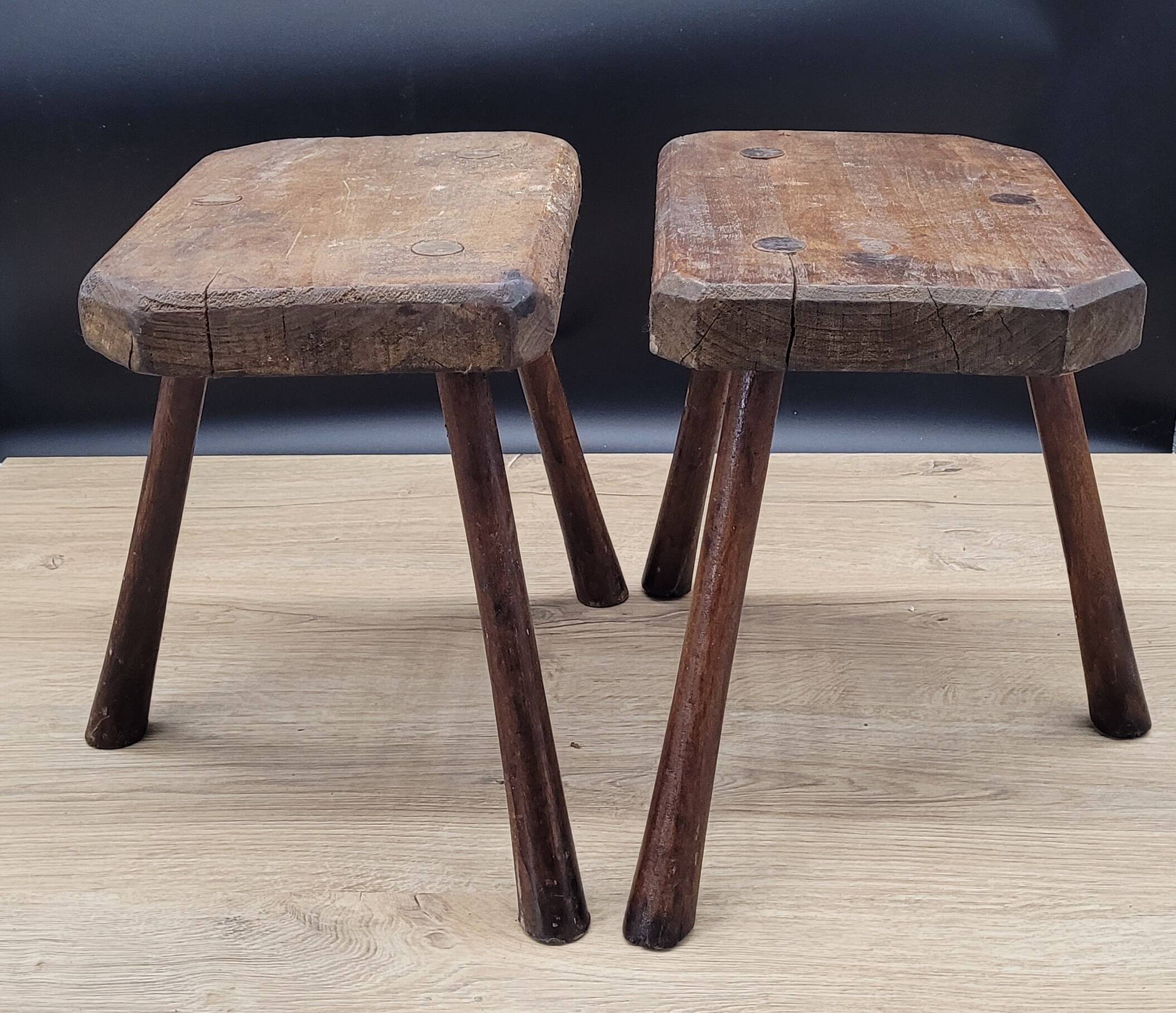Pair of solid octagon cowhide tripod stools