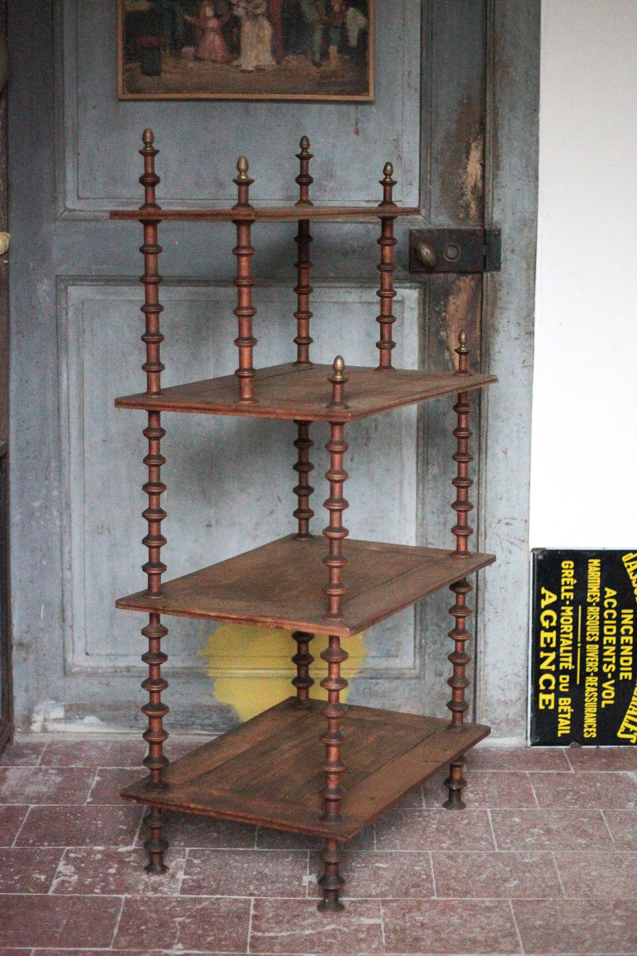 Napoleon III spool shelf, floor-standing shelf with brass tips.