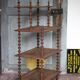 Napoleon III spool shelf, floor-standing shelf with brass tips.