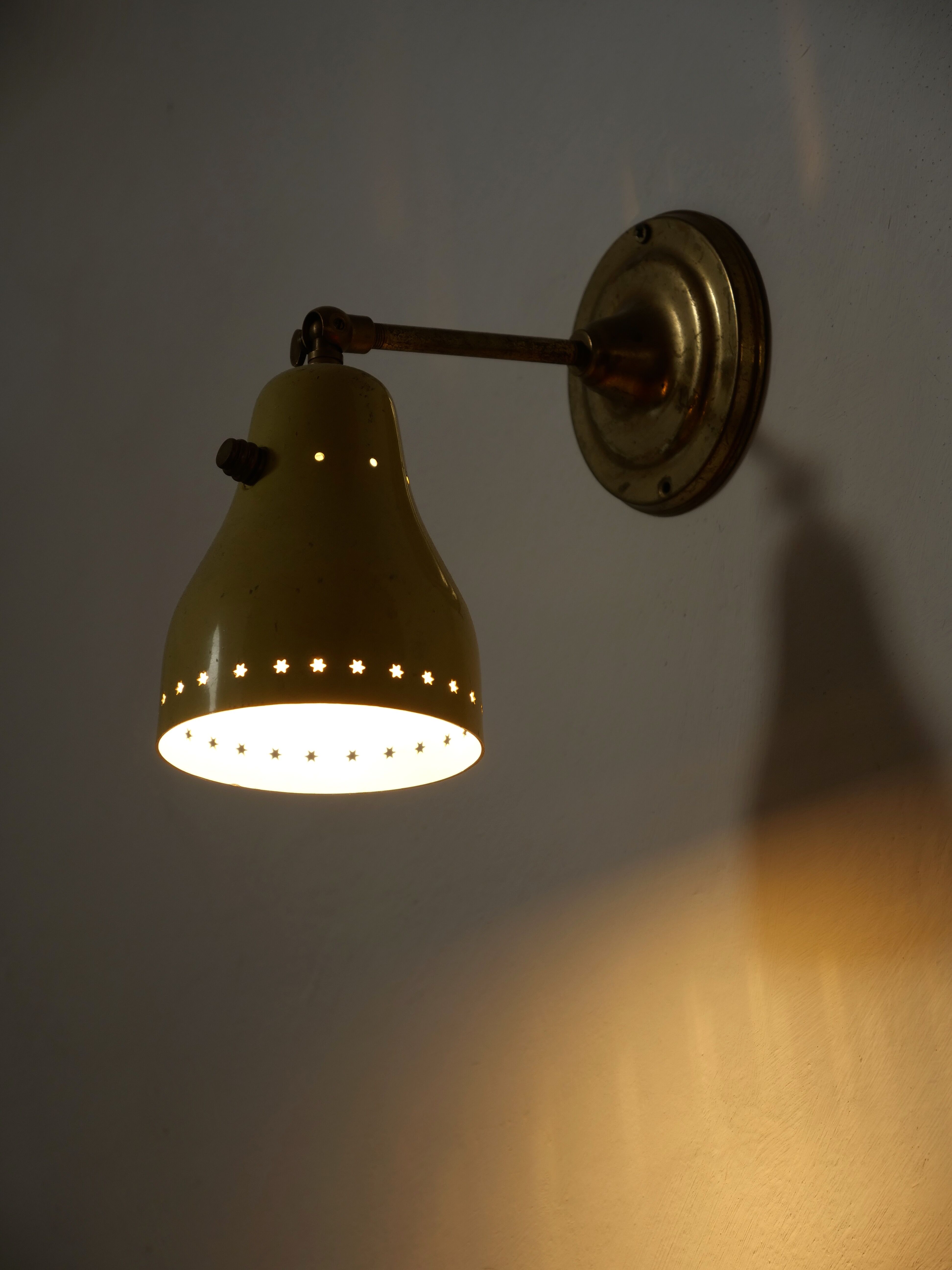 Wall lamp inlaiton and pale yellow lacquered metal