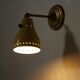 Wall lamp inlaiton and pale yellow lacquered metal