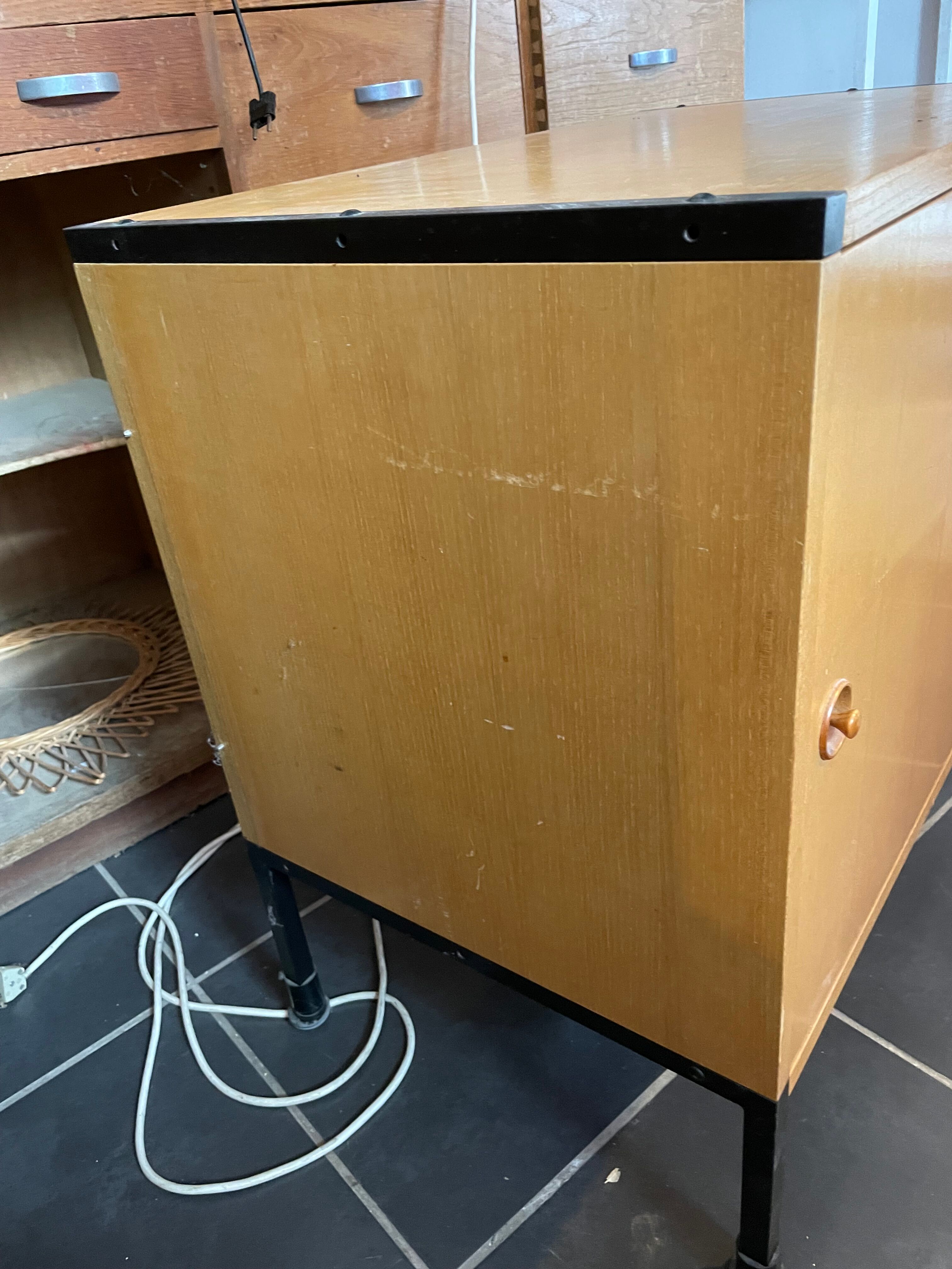 Storage furniture in ash and lacquered metal