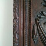 Carved wooden panel décor with music trophy