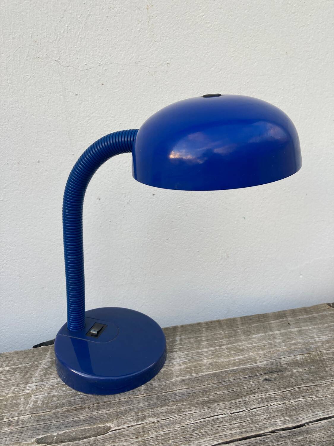 Articulated blue metal bedside lamp