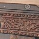 Large square vintage coffee table in wood, glass, and metal decor.
