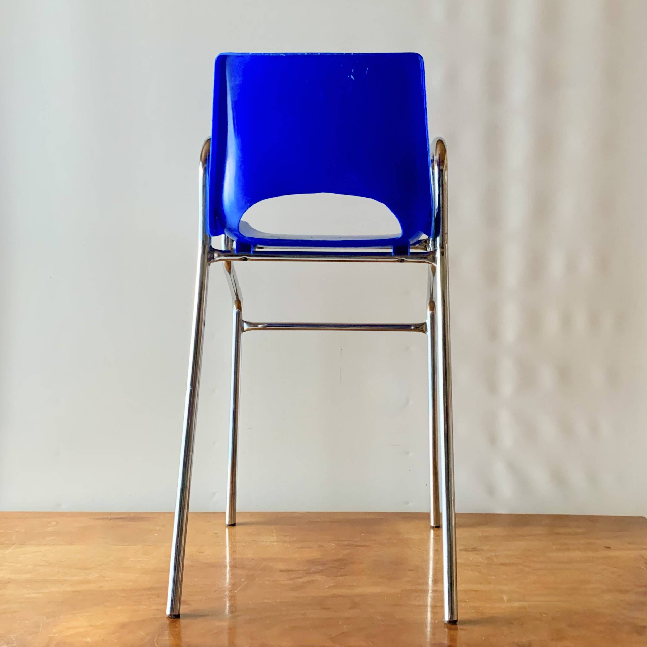 Vintage high chair for children in chrome metal and blue plastic