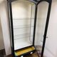 Antique display cabinet repainted in black.