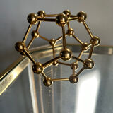 Golden brass atom