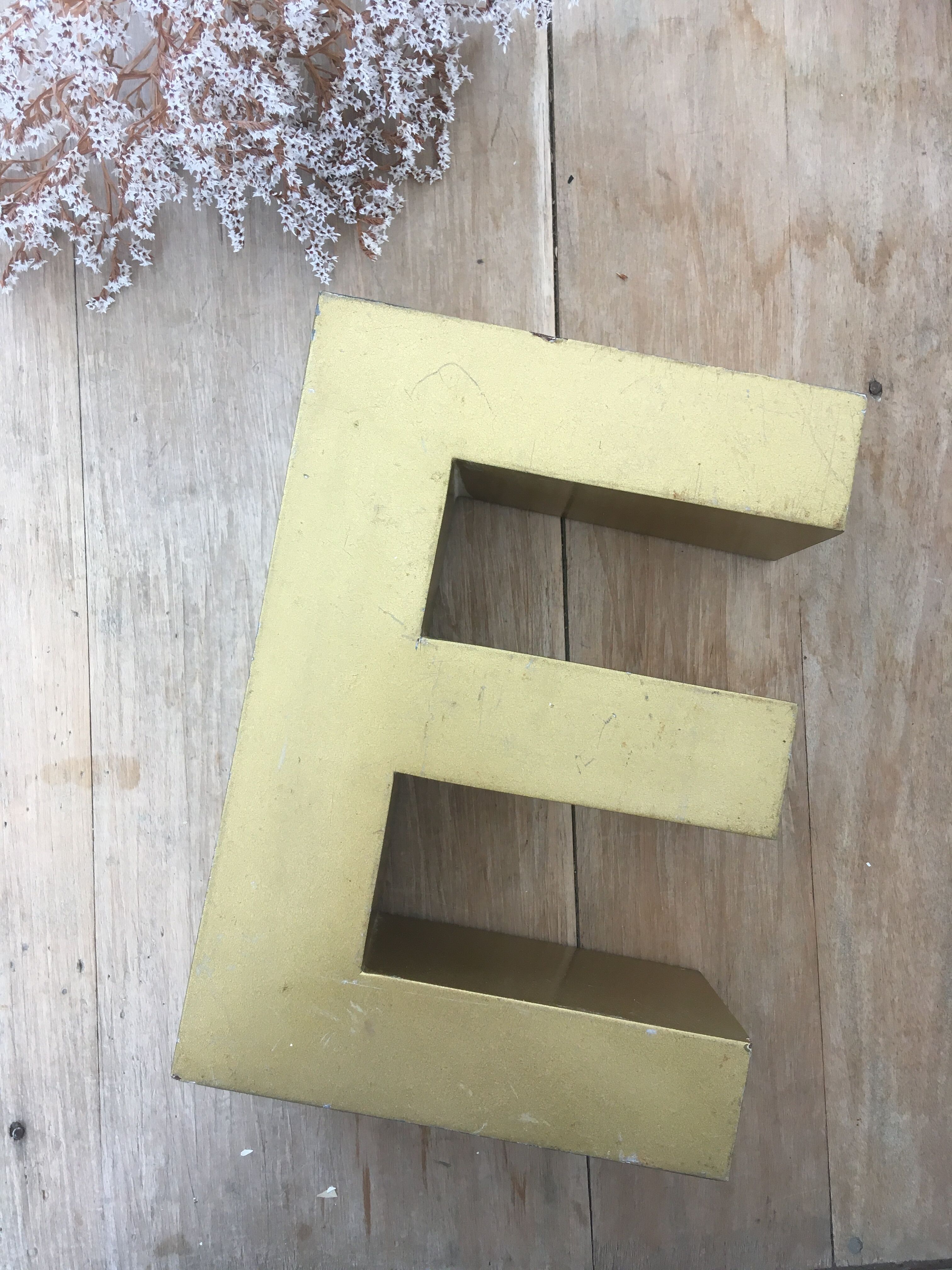 Golden vintage sign letter E
