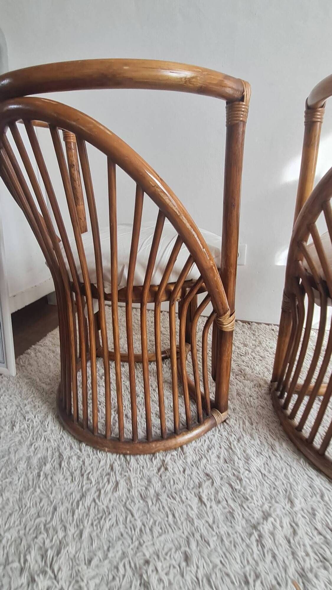 Pair of vintage rattan armchairs circa the 1960s.
