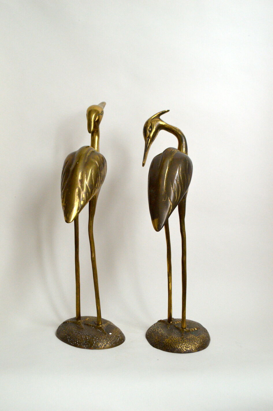 Brass herons couple