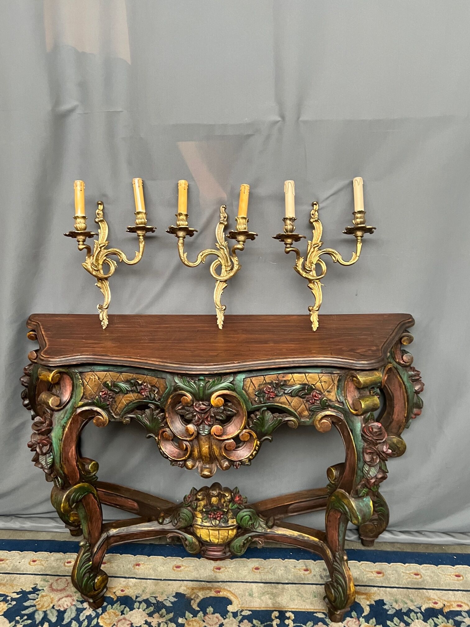 Set of three bronze wall sconces.