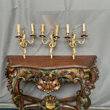 Set of three bronze wall sconces.