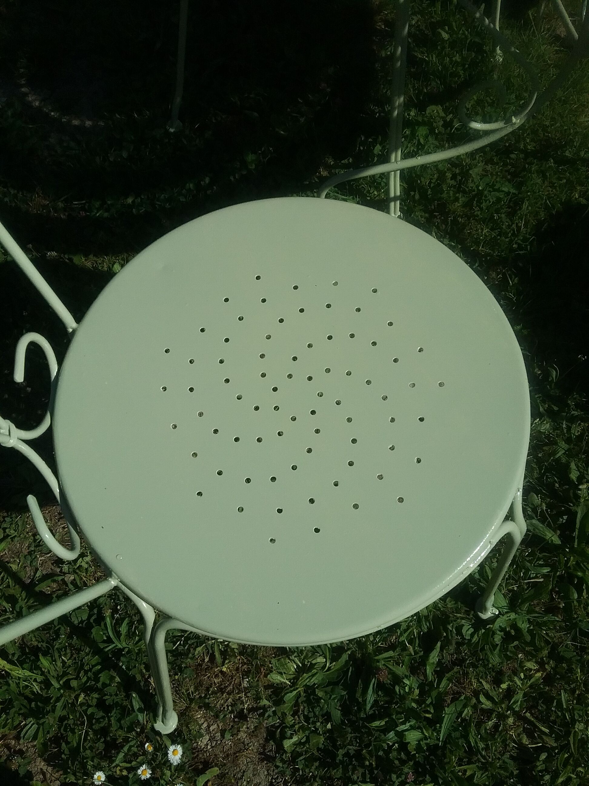 Green wrought iron garden furniture