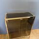 Chrome-plated brass display cabinet with smoked glass.