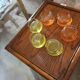 6 Glasses with the name Culbuto in 3 orange colors and 3 lemon yellow colors