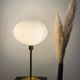 Table lamp with an antique white opaline lampshade and a vintage golden foot