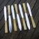 7 old stainless steel and horn knives St Joanis Arbost