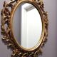 Miroir ovale baroque antique en or 58x84 cm avec cadre orné