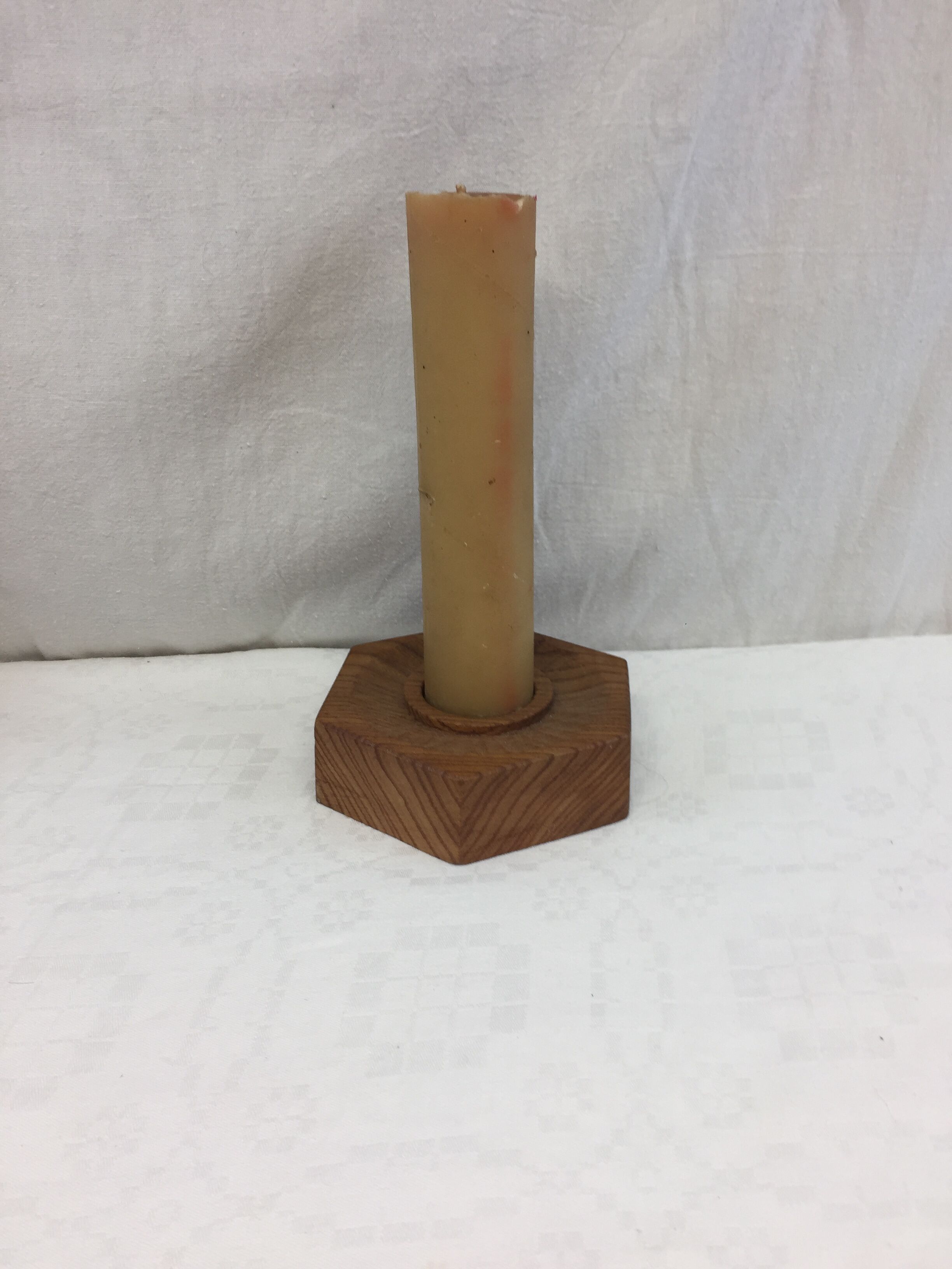 Handmade natural wood candle holder, hexagonal shape and its 3 old beeswax candles.