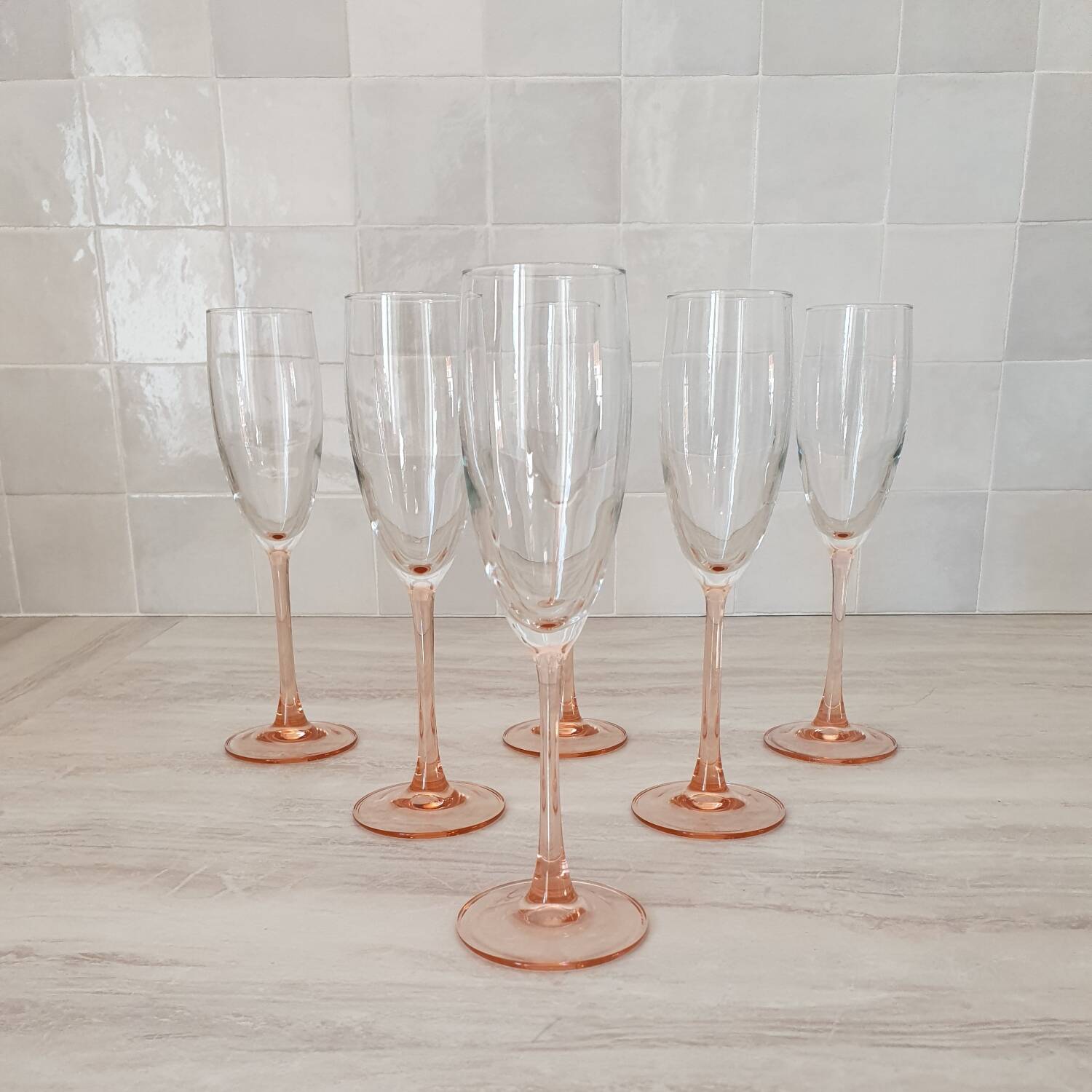 6 champagne flutes with pink stems