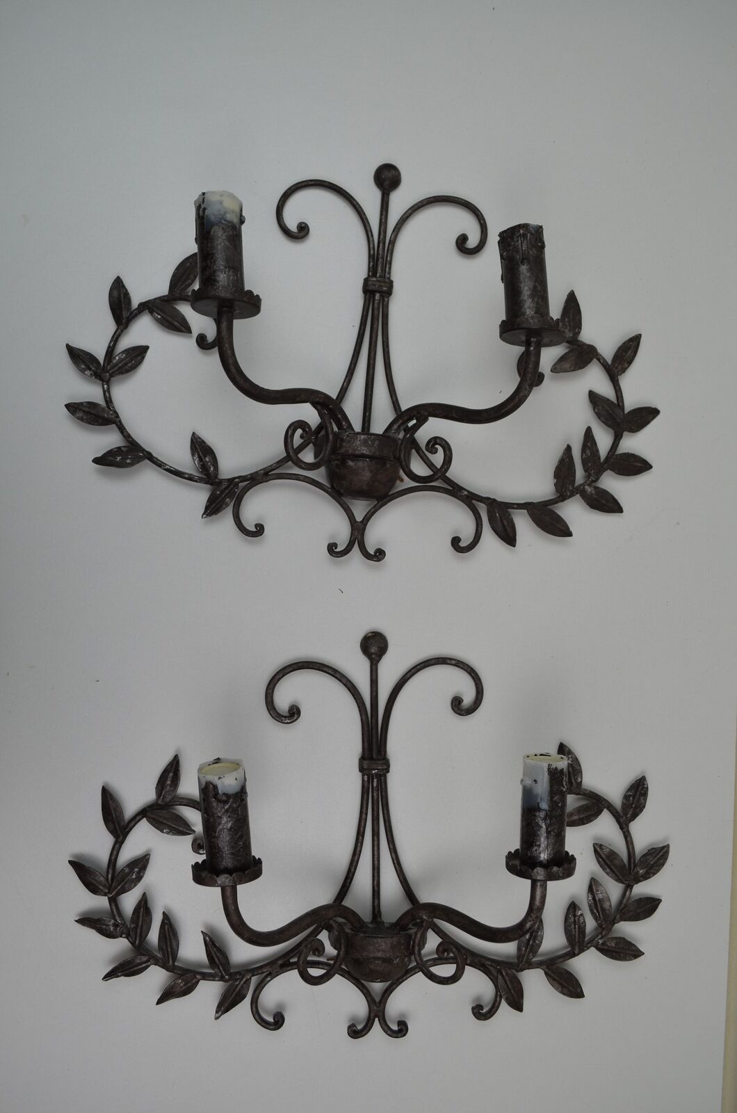 pair of grey patinated iron wall sconces