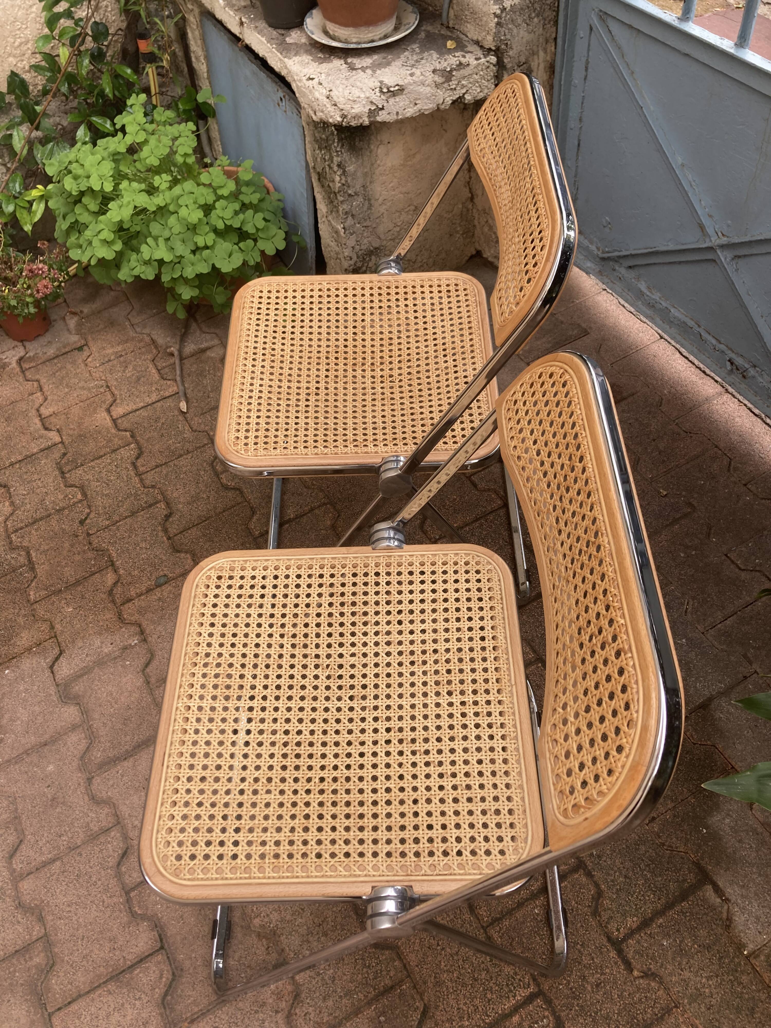 Plia chairs by Castelli in wood and cane.