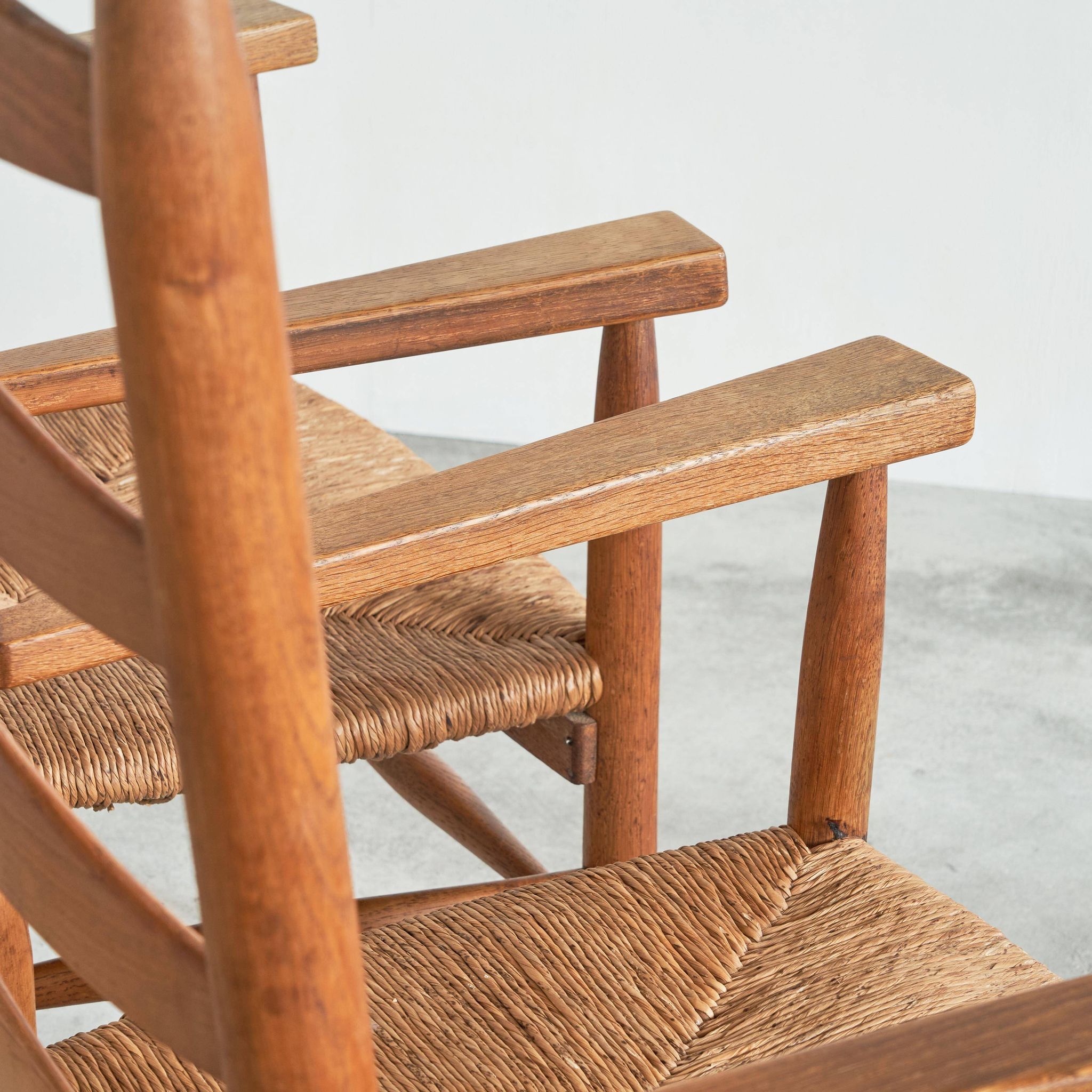 Set of 2 oak and wicker armchairs, mid-20th century.