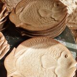 Deep plates in the shape of fish in stoneware