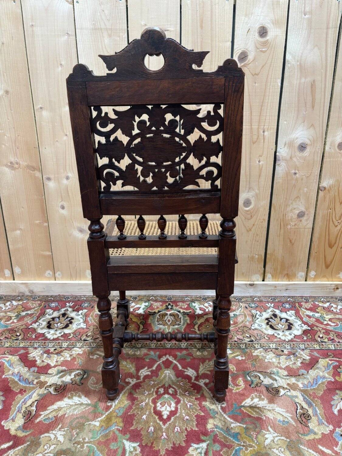 6 High Era chairs in carved solid oak and rattan caning.