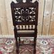 6 High Era chairs in carved solid oak and rattan caning.